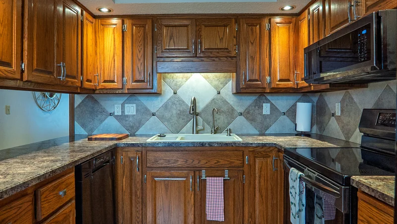 Wood cabinets and patterned tile in the Plumbwood Lane kitchen