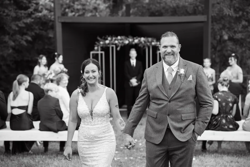 Darin and Kelly walking together in black and white